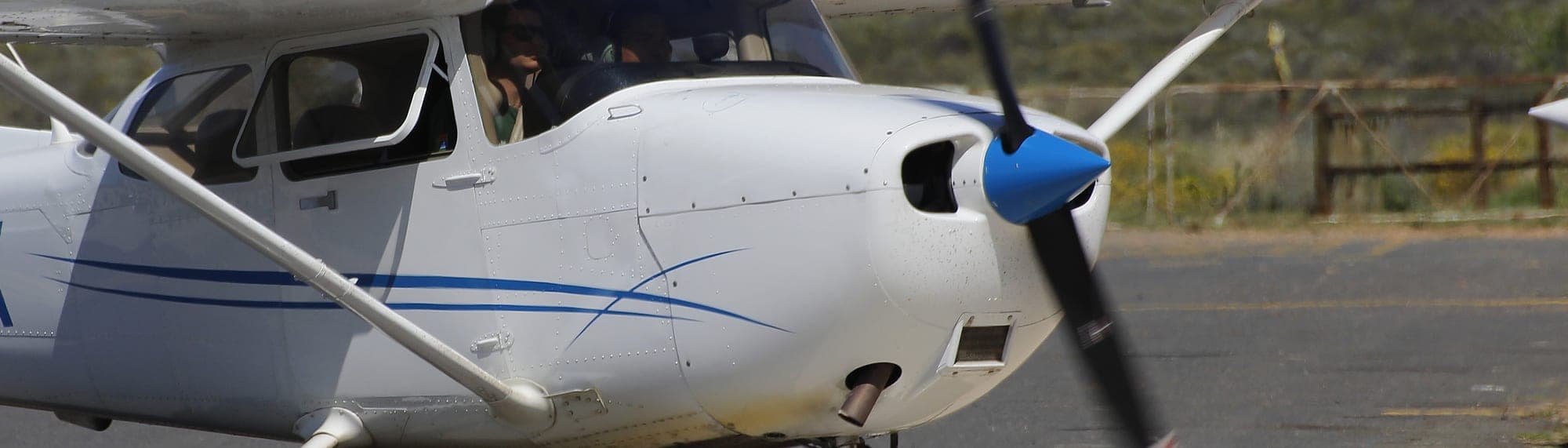 Single-engine aircraft on an airport taxiway, seen from above