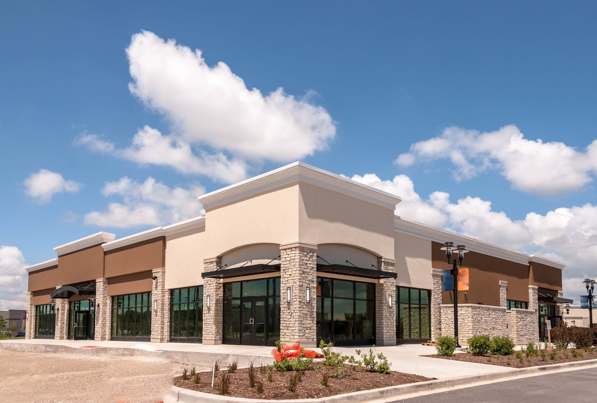 Newly built retail building with stone and stucco facade
