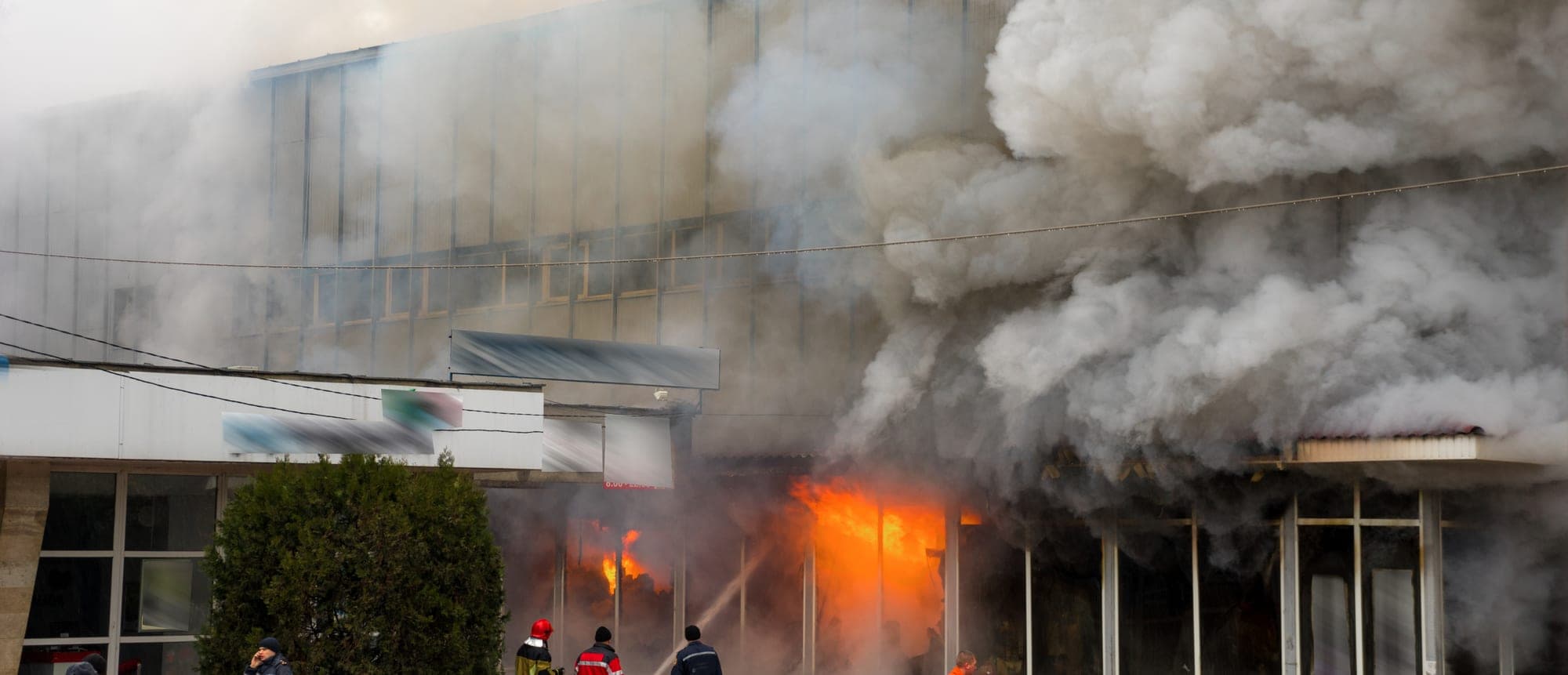 Balcony fire and black smoke on a high-rise apartment block