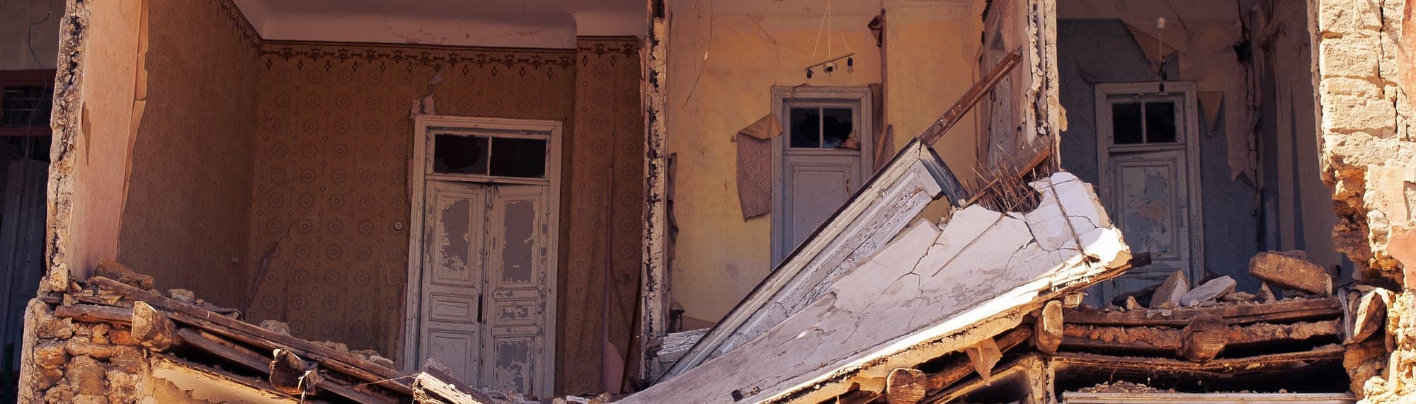 Collapsed brick and concrete building reduced to rubble