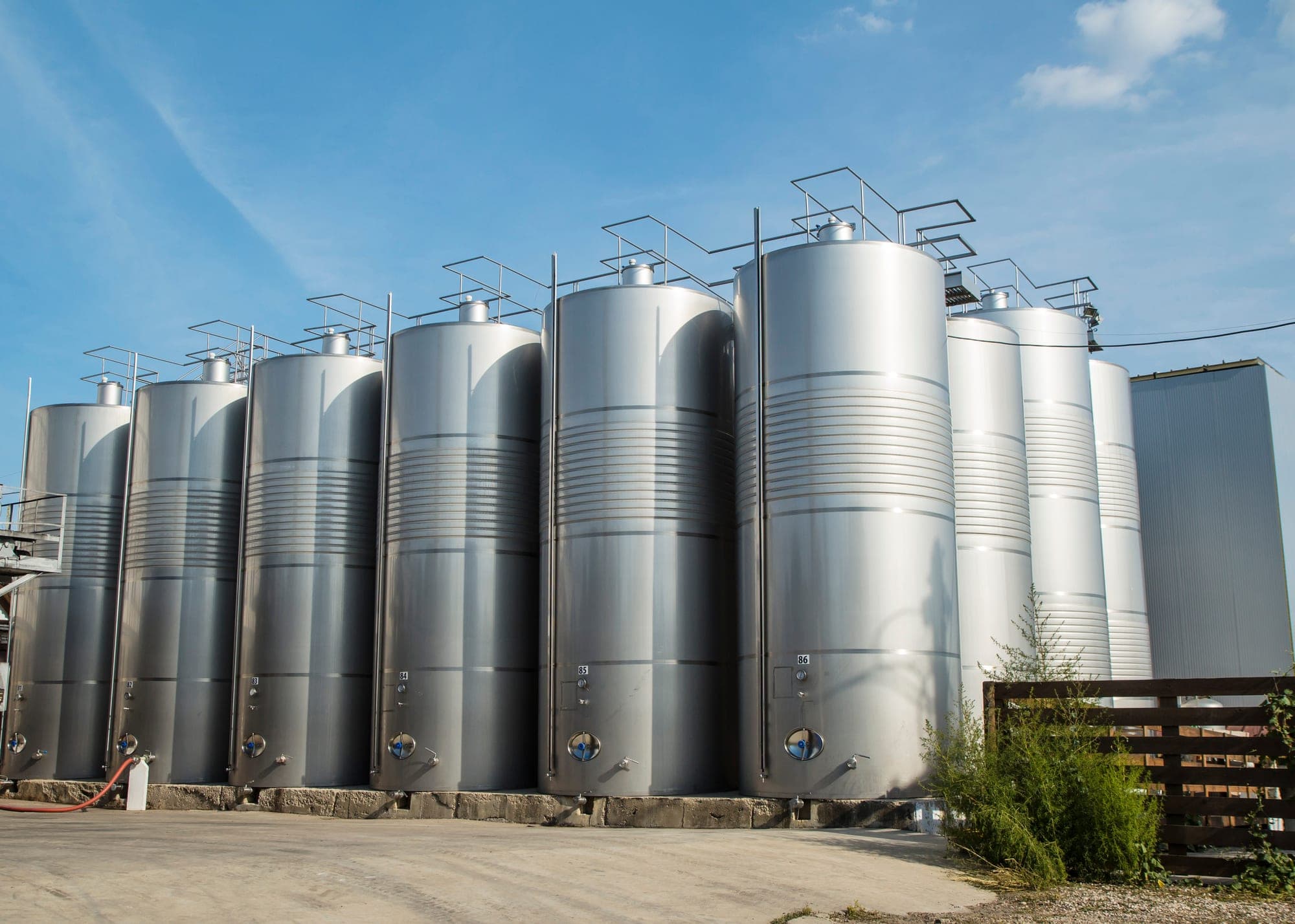 Stainless steel storage tanks at an industrial facility