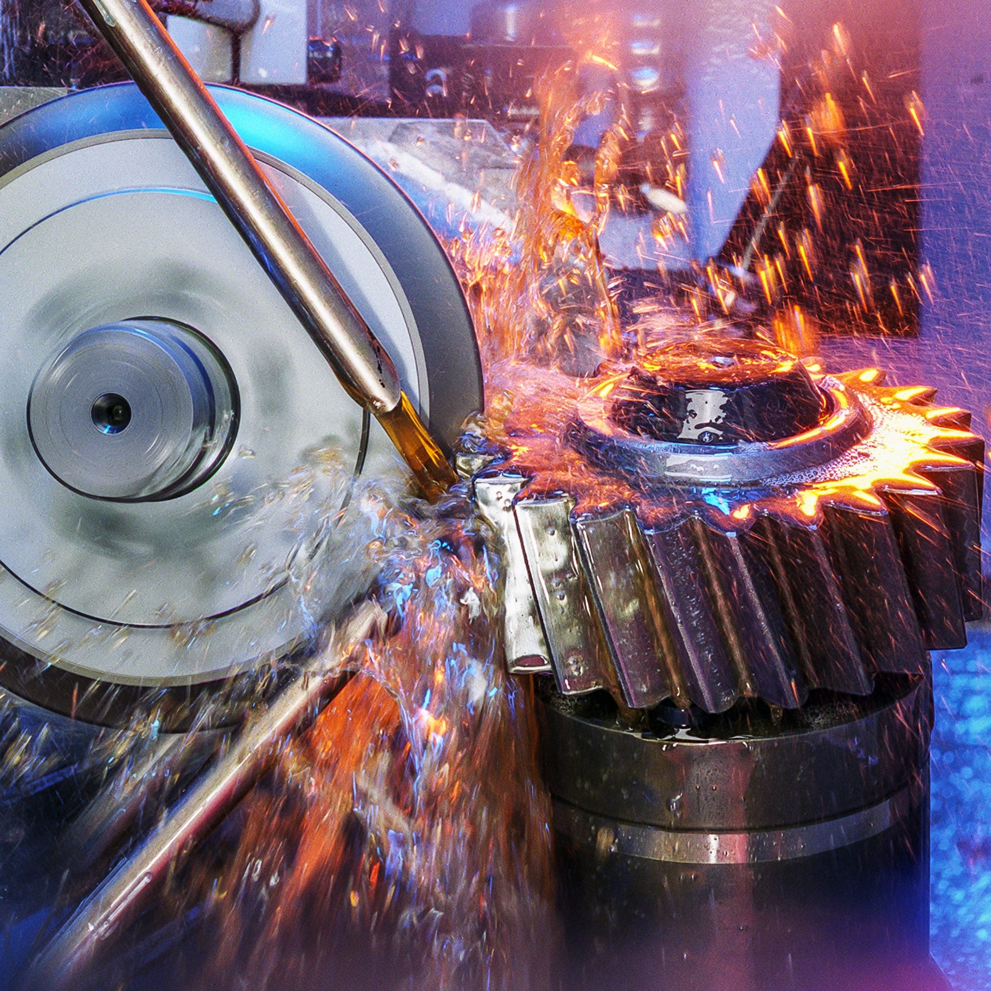 Steel gear being machined amid sparks and coolant spray